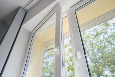 White casement window open in home